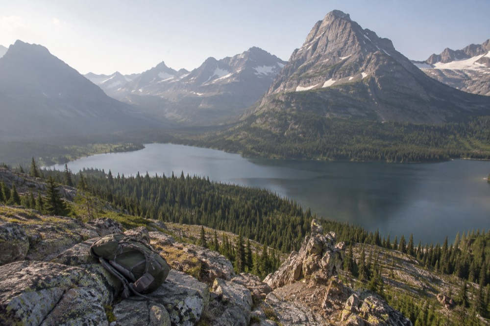A view of a glacial lake from a high trail with mountains