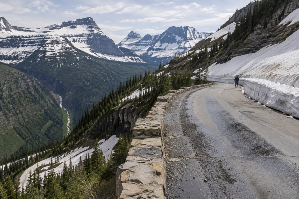 Snowbanks lining a mountain road in early summer