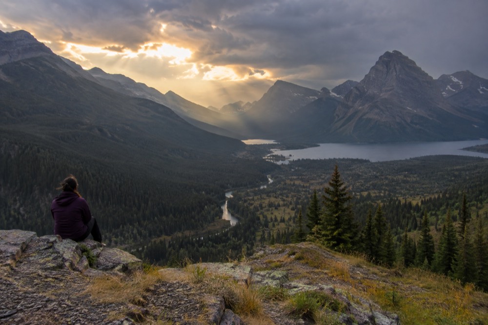 A wide valley view from a mountain overlook with a river below