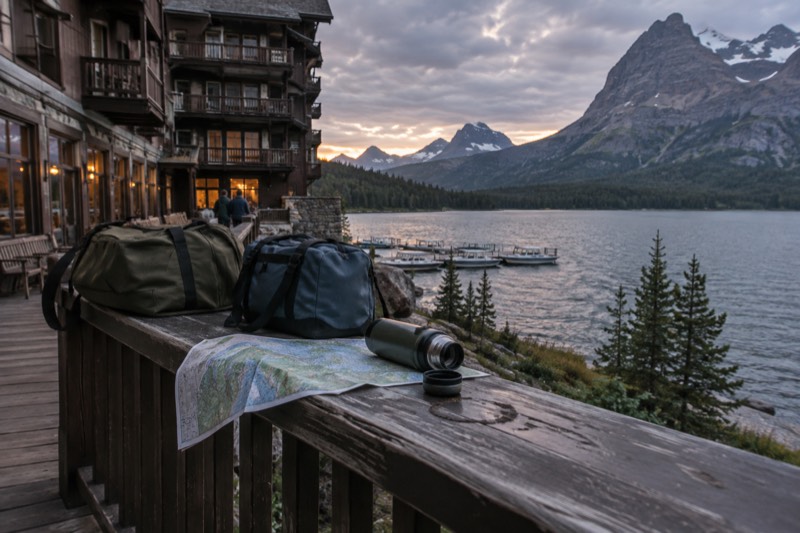 Private SUV tour vehicle parked at a mountain overlook in Glacier National Park on a customizable multi-day package